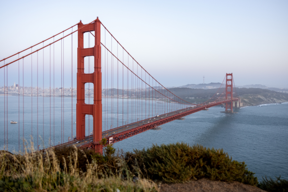 Abstract navy and gold toned photo of the Golden Gate Bridge, representing California’s AI Transparency Act