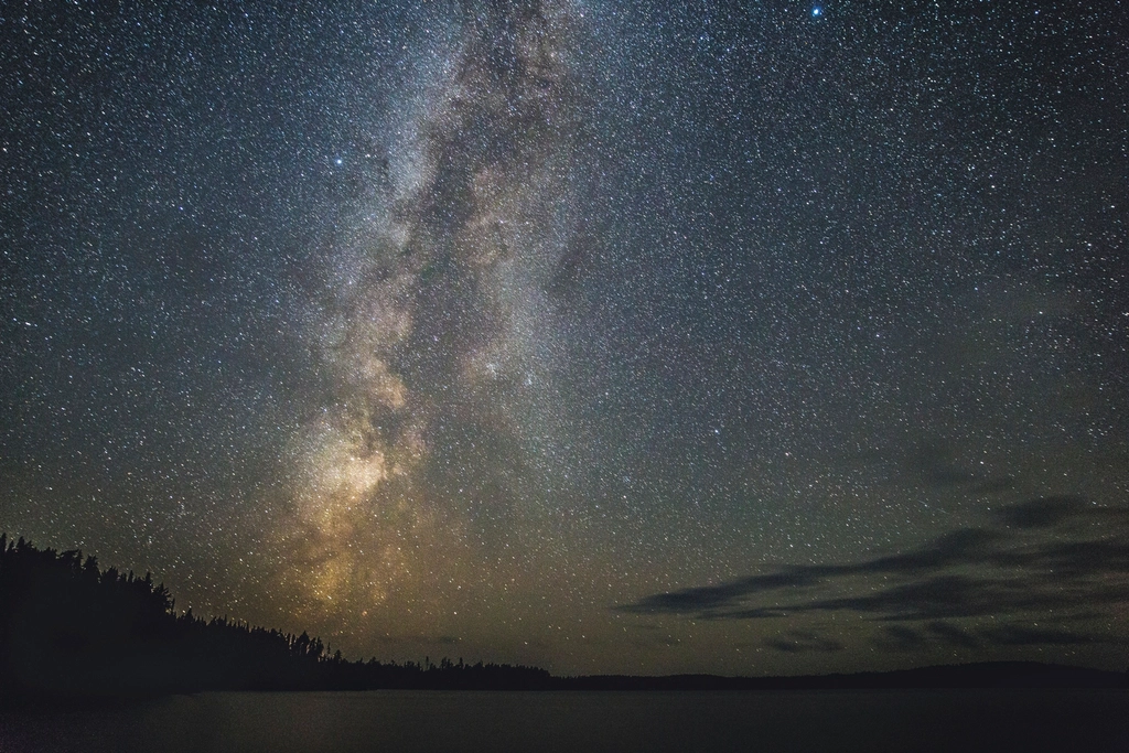 Abstract navy and gold toned photo of the Milky Way over a night sky, representing Gemini 3.5 Pro
